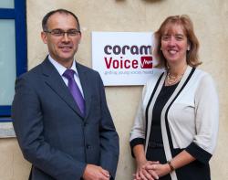 Carol Homden and Andrew Radford with Voice logo